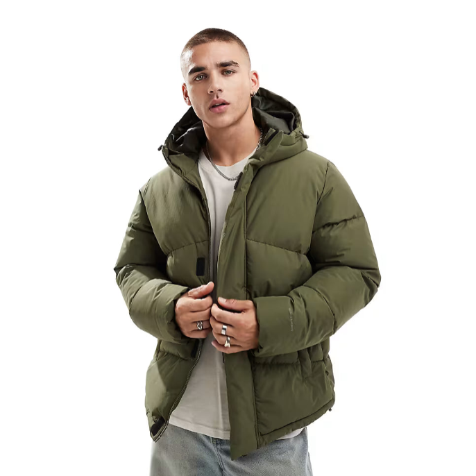 Man wearing a green puffer jacket on a white background